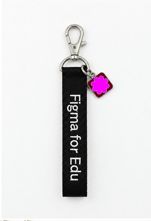 Black embroidered Figma for Edu tag with a pink flower enamel charm